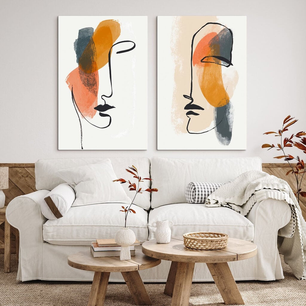 Two faces drawn on paper