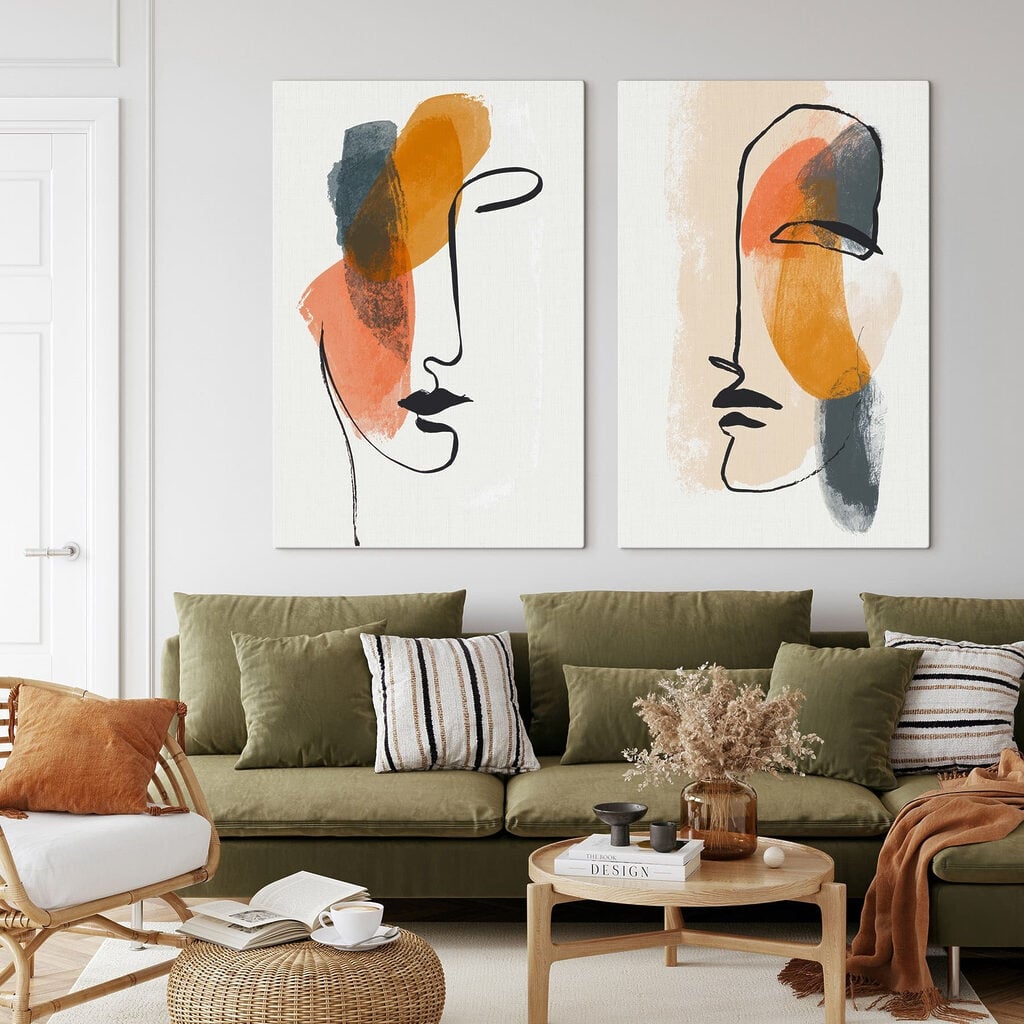 Two faces drawn on paper