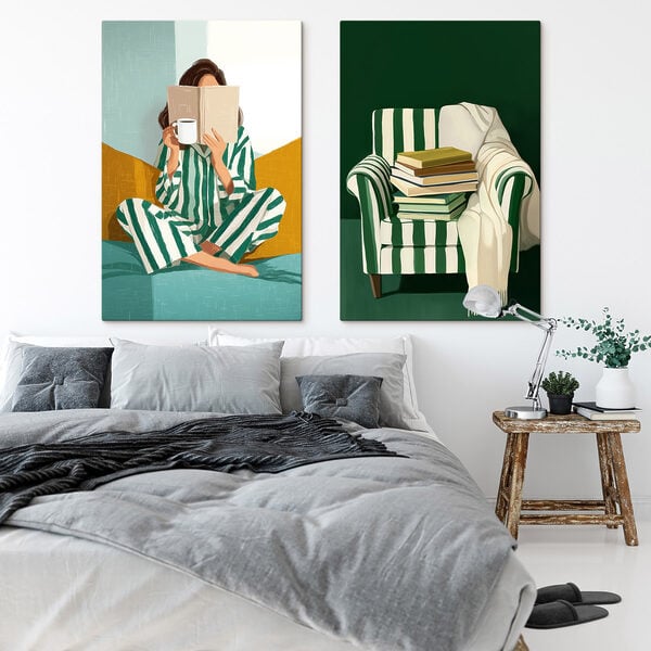 Woman in pajamas reading a book and a pile of books